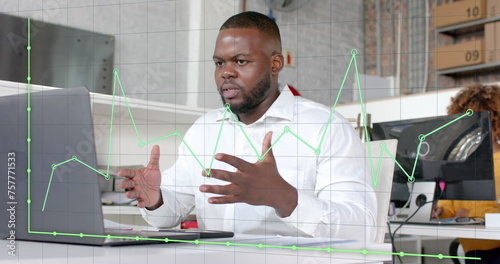 Graph processing over african american casual businessman having laptop image call in office
