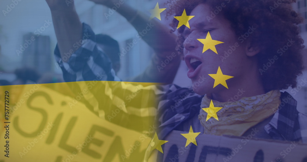 Fototapeta premium Image of flag of ukraine and european union over diverse protesters