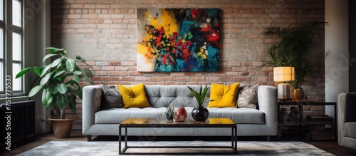 A stylish living room featuring a studio couch, coffee table, and a beautiful painting on the rectangular wall. The interior design is complemented by a plant and cozy flooring © 2rogan