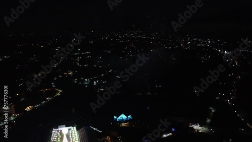Firework in Mexican City at night during festival show. Aerial top down shot. photo