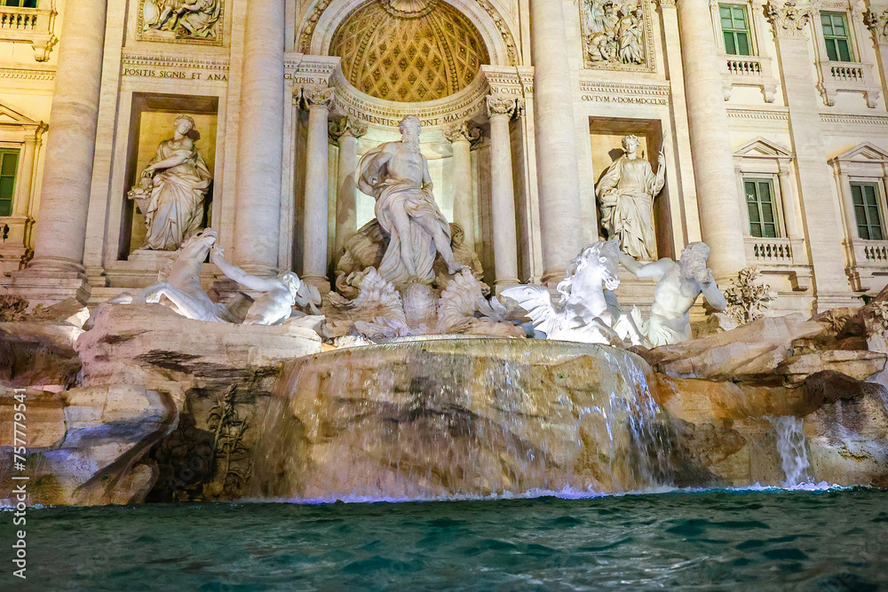 Baroque Trevi Fountain illuminated at night. Architect Nicolo Salvi, Rome, Italy