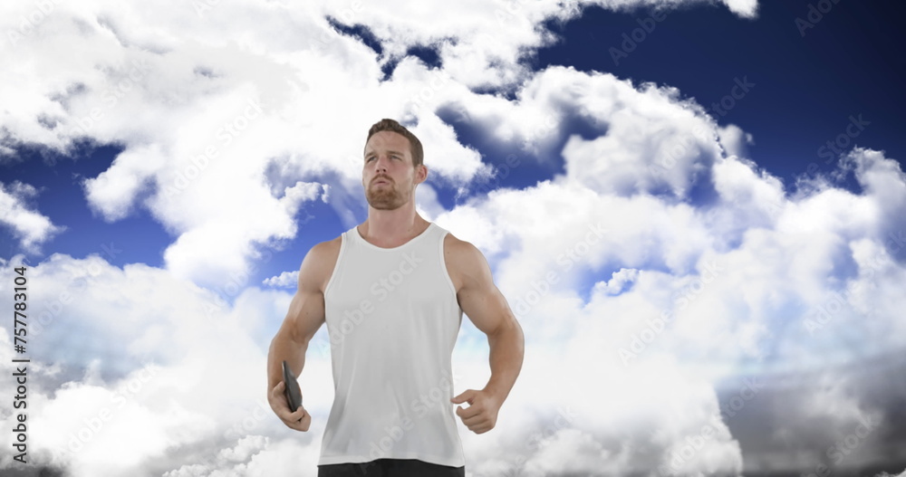 Digital image of a Caucasian man limbering up by jumping up and down in preparation for a disk throw Digital image of a Caucasian man limbering up by jumping up and down in preparation for a disk throw