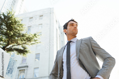 Businessman, city and buildings with thinking for accounting, career or business in Los Angeles. Professional man, entrepreneur and vision with confidence for opportunity mindset and ambition