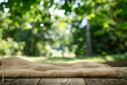 Nature background and table wood for product display template, Empty wooden table and sack tablecloth over blur green tree at park, garden outdoor with bokeh light background - generative ai photo