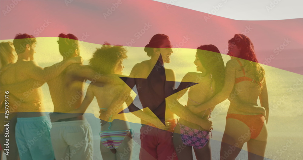 Obraz premium Image of waving ghana flag over diverse friends standing and forming chain at beach