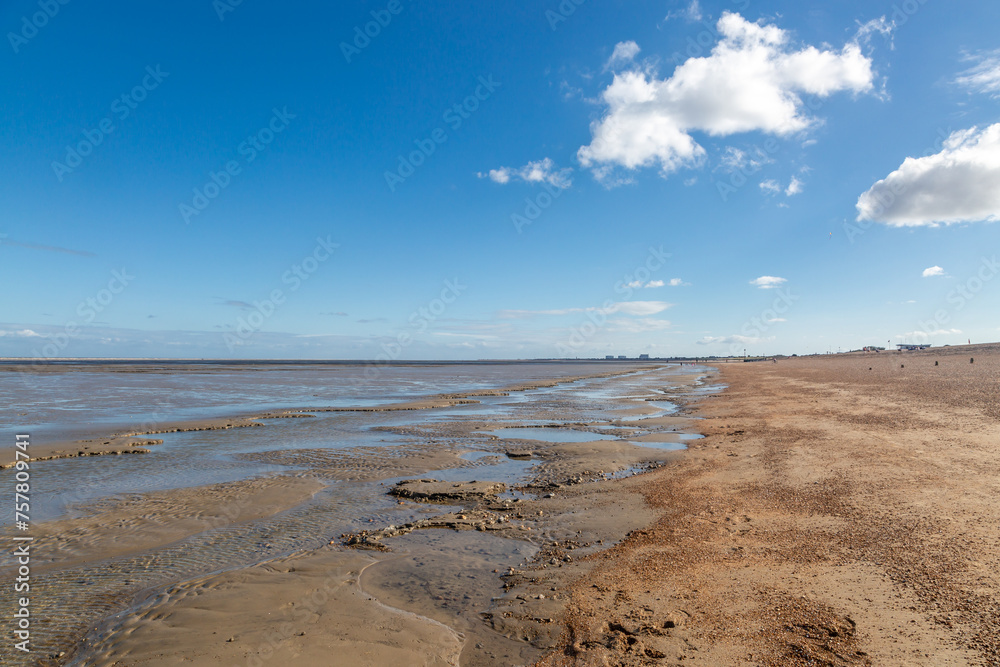A view along the beach at Littlestone-on-sea, on a sunny summer's day