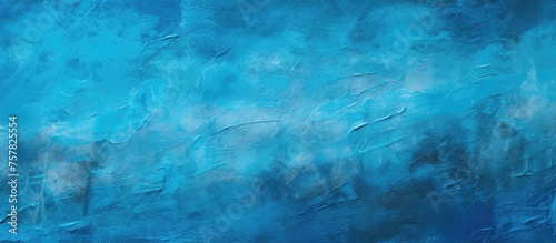 A detailed closeup of an electric blue painting with shades of magenta, resembling a fluid pattern like clouds or water, against a dark background