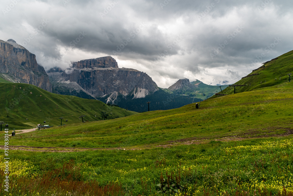 Fototapeta premium Dolomites mountains in Italy - Sella mountain ridge from meadows above Sella pass