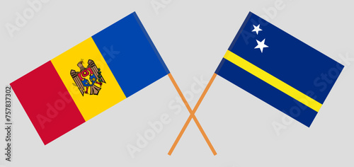 Crossed flags of Moldova and Country of Curacao. Official colors. Correct proportion.