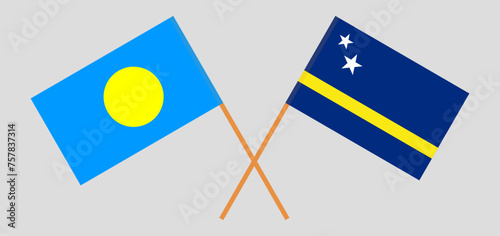 Crossed flags of Palau and Country of Curacao. Official colors. Correct proportion