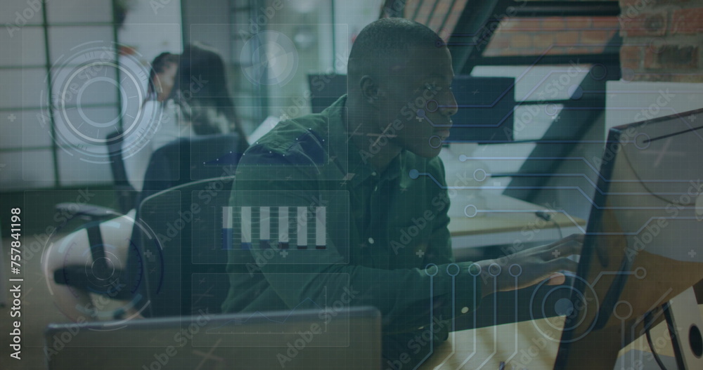 Image of data processing over african american businessman using computer