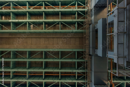 steel frame and concrete construction huge car bridge across the wide river. © hiv360