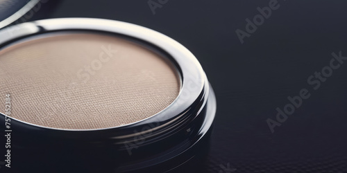 Compact Powder on simple Background with copy space. High-quality makeup compact with decorative cosmetic dry powder. 