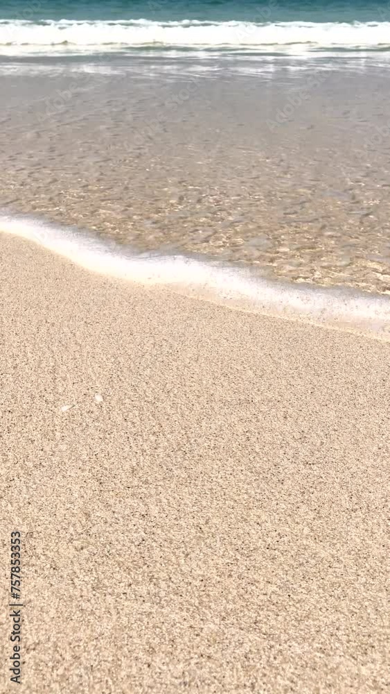 Waves on the sandy shore. Horizon. Close-up. The movement of a wave on smooth sea sand. The seashore. . Seascape. Waves on the beach. A sunny summer day. Waves on the sandy shore. Horizon. Close-up. The movement of a wave on smooth sea sand. The seashore. . Seascape. Waves on the beach. A sunny summer day.