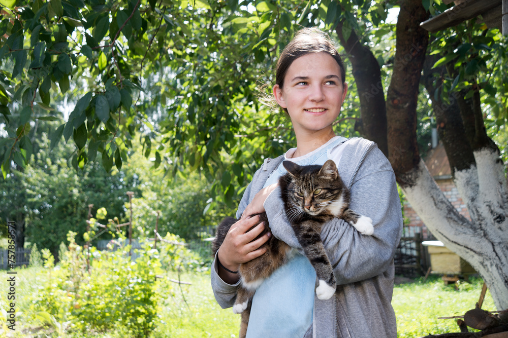 Obraz premium Young girl with cute cat