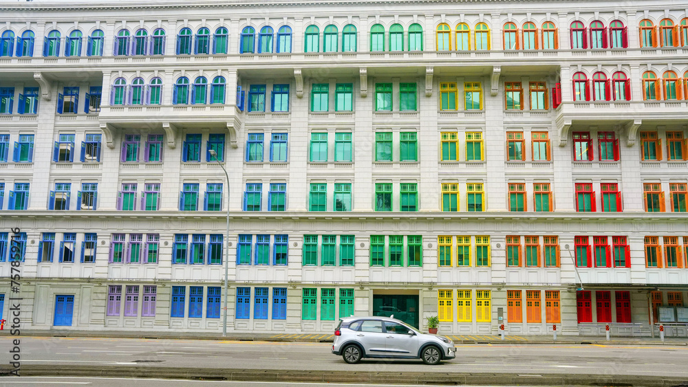 Colorful heritage building in Singapore with colorful windows.