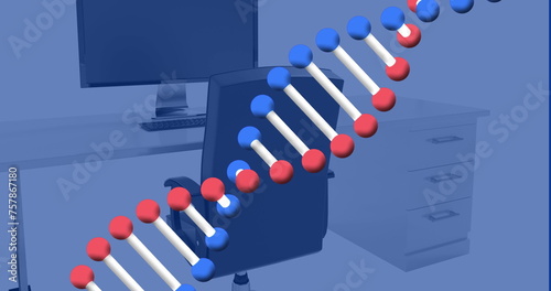 Image of dna structure spinning against computer on office desk