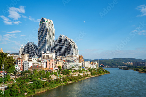 Lancang River and buildings on both sides, cityscape of Xishuangbanna, Yunnan, China. photo