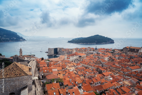 Amazing panoramic view of picturesque Dubrovnik old town, towers, narrow stone streets and buildings with red roofs on Adriatic sea coast, Croatia.