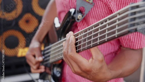 African man playing guitar in a band