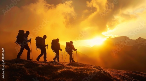 A group of hikers in silhouette trekking against a vibrant sunset in the mountains, symbolizing adventure and exploration.