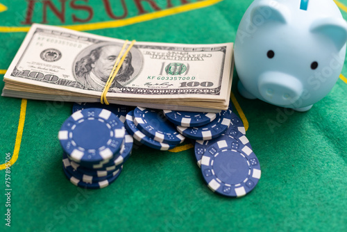 Poker playing chips with card and dollar banknoteson a casino green table. Online gambling. Texas photo