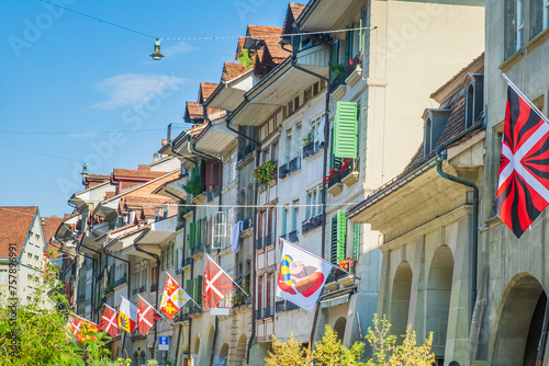 Flags among the street in the historic street in the old town of Bern, Switzerland