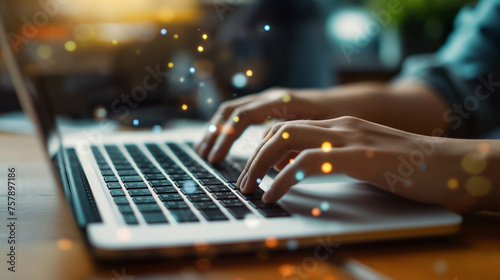 Office person typing on a laptop with bokeh effect