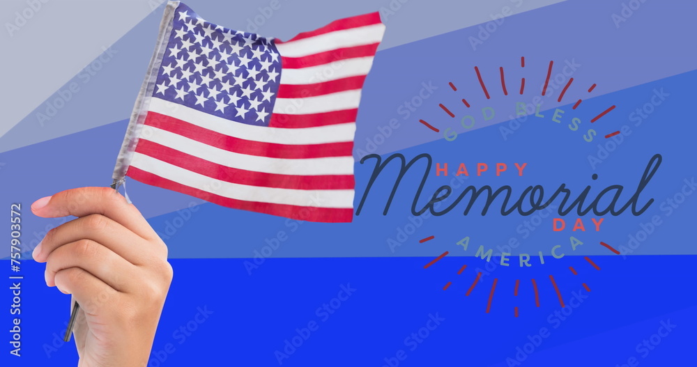 Obraz premium Composition of hand holding american flag over happy memorial day text, on blue stripes