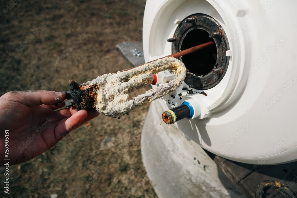 Replacing a heating element damaged by scale and limescale. Repair and