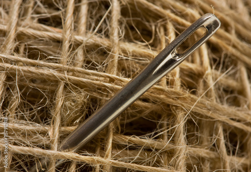 macro picture of sewing needle in clew