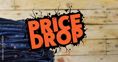 Image of price drop text over denim trousers on wooden background