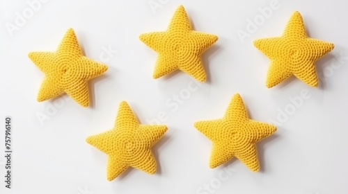 Knitted stars on a monochrome colored background, top view, with space for text. Greeting card, hobby, knitting, children's toy.