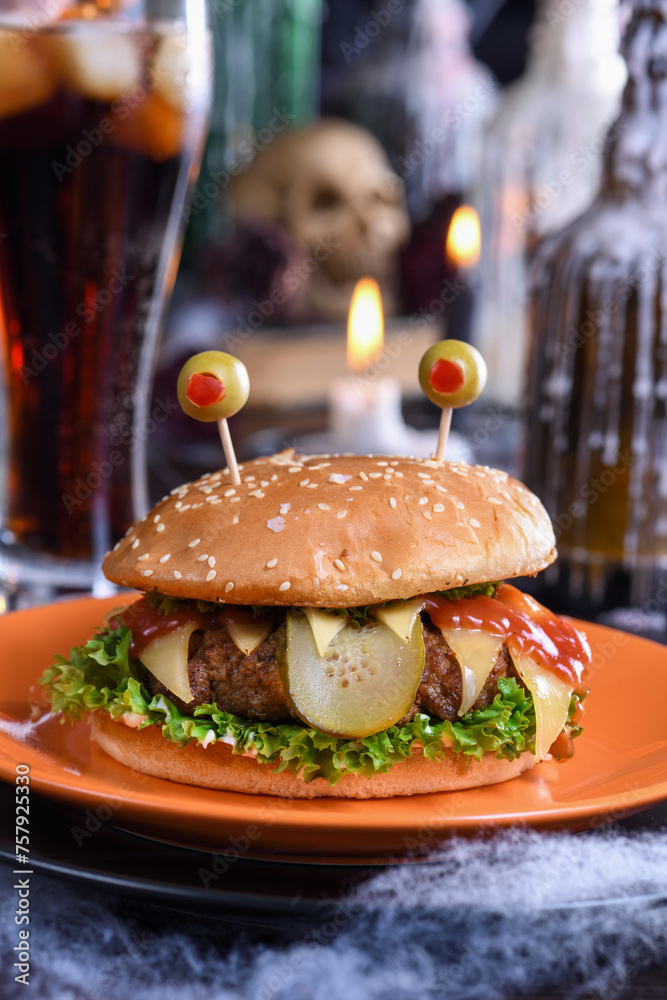The Monster Burger will definitely lift your spirits and is the perfect snack for a Halloween party. - obrazy, fototapety, plakaty 