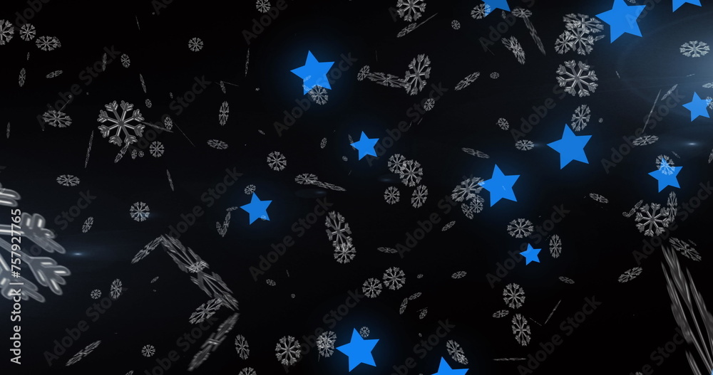 Fototapeta premium Image of snow falling over blue glowing stars