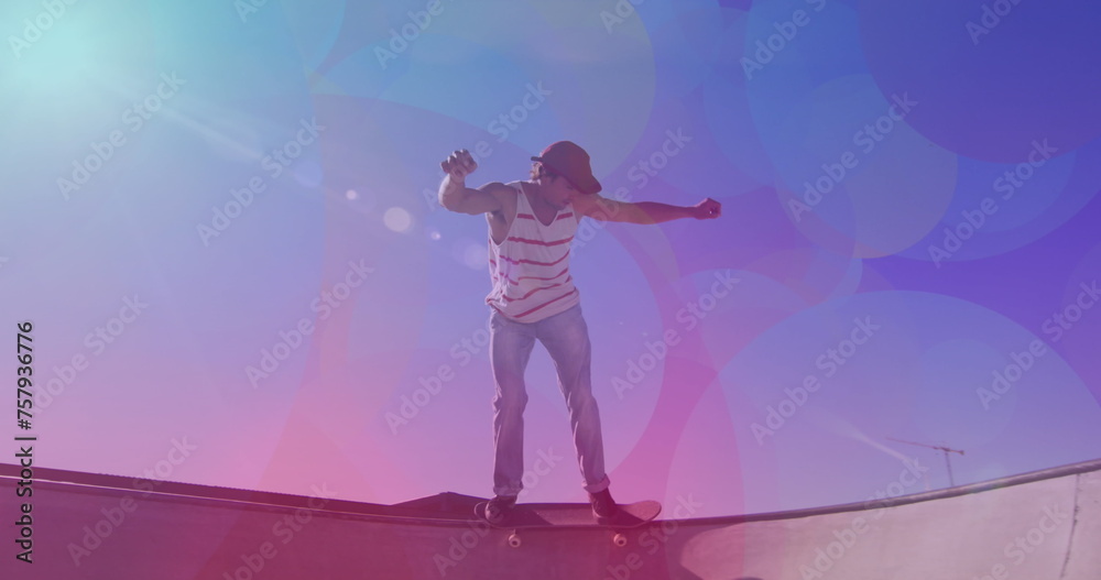 Image of colourful spots over caucasian man skateboarding