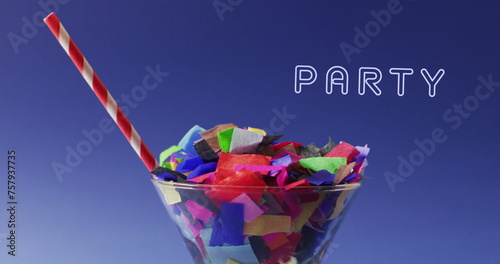 Image of party text over party confetti in cocktail glass in background