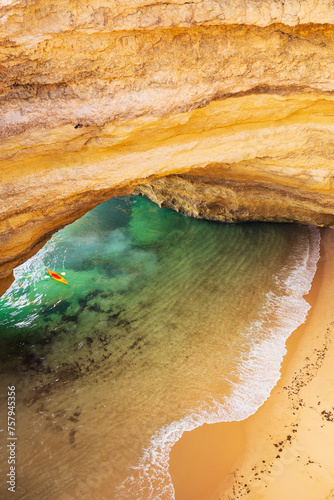 Benagil cave in Algarve Top down view.  Beautiful sandy beach with turquoise water and kayak. Lagos, Carvoeiro, Algarve, Portugal