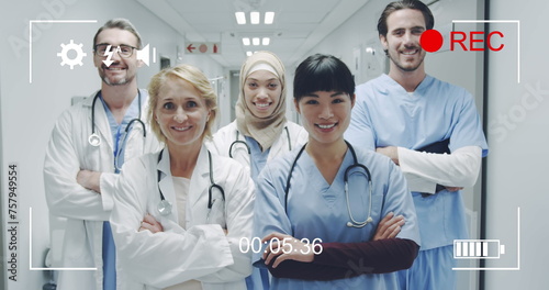 Diverse doctors smile in a portrait on a camera screen in 4k record mode.
