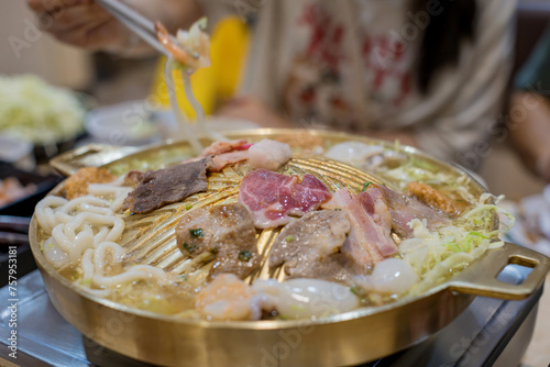 Thai traditional barbecue street food. Pork slice grilled on yakiniku hot pan.Barbecue japanese style