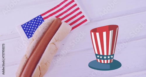 Image of hot dog and hat in usa flag colours over white surface