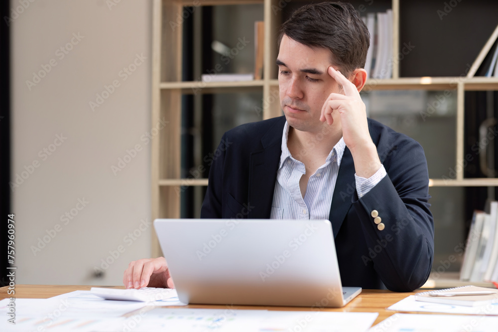 Seriously irritated businessman with eyes closed, migraine headache at work, temple massage, feeling tired, chronic work stress, trying to remember important information. Seriously irritated businessman with eyes closed, migraine headache at work, temple massage, feeling tired, chronic work stress, trying to remember important information.