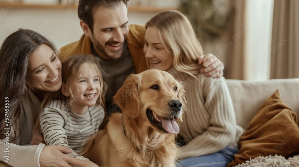 A happy smiling family next to their dog, smiling and playing at home