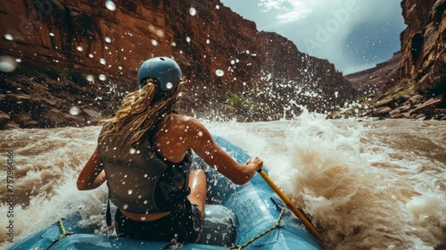A female rafting in rapid water in rugged lands.