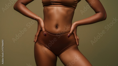 Confident Beauty in Wellness - Close-up of Fit Female Torso in Chic Sportswear on Olive Green Background