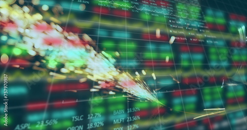 Image of trading board and graphs over close-up of sparkling fire