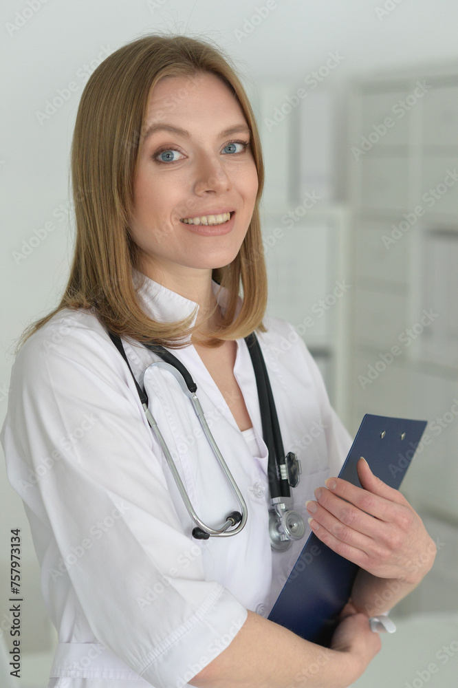 Young female doctor posing in the office Young female doctor posing in the office