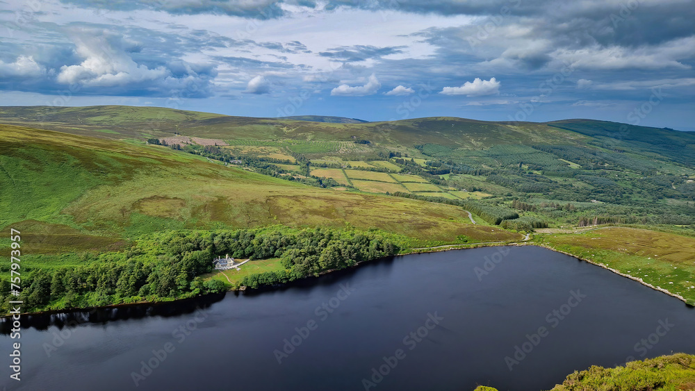 From the heights of the peak, Lough Bray Lower unfolds below like a breathtaking painting.