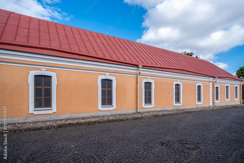 A long stone one - story building .