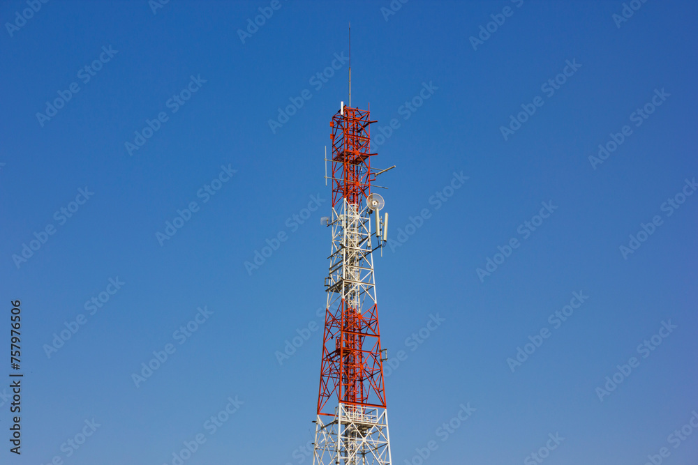 Telecommunication and internet tower isolated on blue sky background
